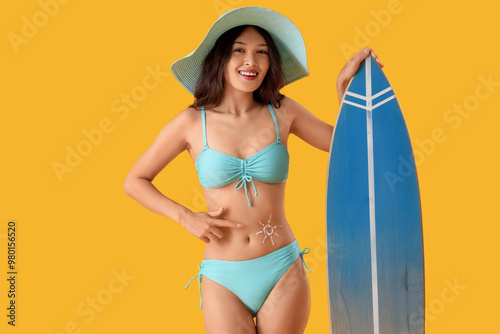 Young Asian woman in swimsu...