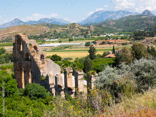 Scenic landscape of aqueduct in anciet city Aspendos, Antalya Province, Turkey. photo