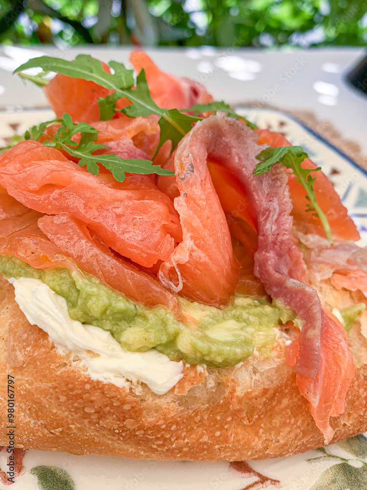 Gourmet Avocado and Salmon Toast with Fresh Arugula Gourmet Avocado and Salmon Toast with Fresh Arugula