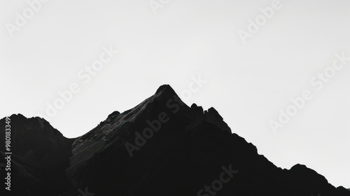 Silhouette of Mountain Peaks Against a Clear Sky