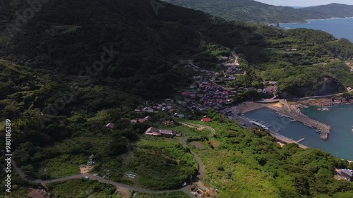 Aerial View of a Serene Coastal Village Nestled Amidst Lush Nature and Beautiful Scenery