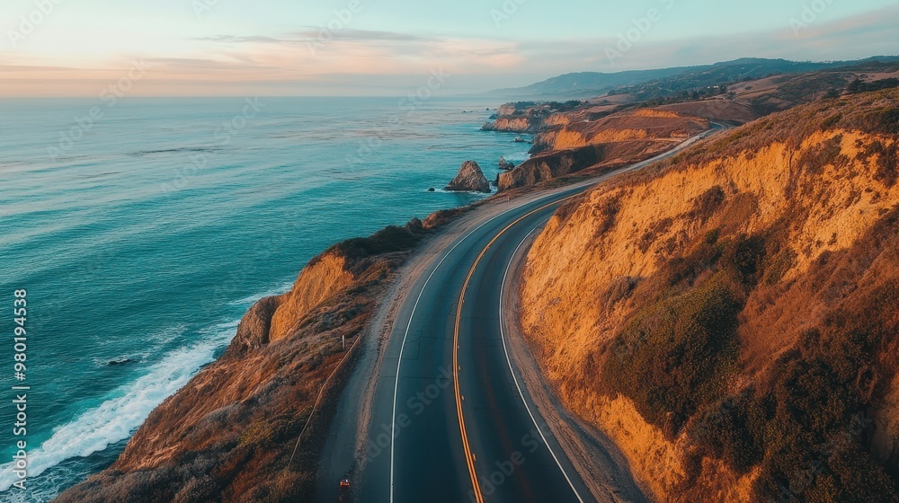 Fototapeta premium Coastal Highway Winding Through Rugged Cliffs