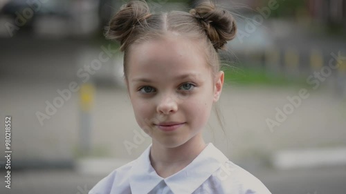 Wallpaper Mural Face of a cute little girl with a cute hairstyle. Closeup portrait of a child girl in the city Torontodigital.ca