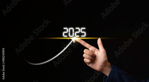 Obraz na płótnie arrow go to target in 2025 growth business, Businessman analyzing economic trend data for long-term investment in 2025. Set up objective target business cost and budget planning for new year concept w salonie