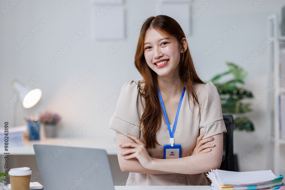 Young happy woman work on laptop, asian female reading financial document report or learning online education and business concept.
Young happy woman work on laptop, asian female reading financial document report or learning online education and business concept.