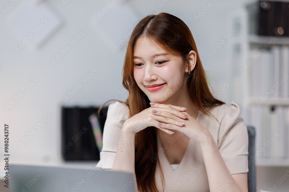 Young happy woman work on laptop, asian female reading financial document report or learning online education and business concept.
Young happy woman work on laptop, asian female reading financial document report or learning online education and business concept.