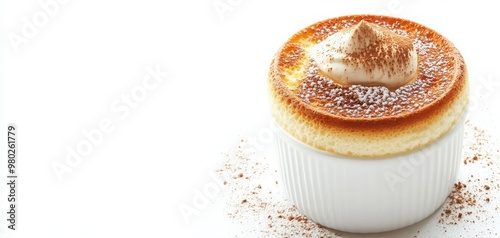 Delicious creamy dessert served in a white ramekin, topped with a dollop of cream and a sprinkle of cocoa powder.