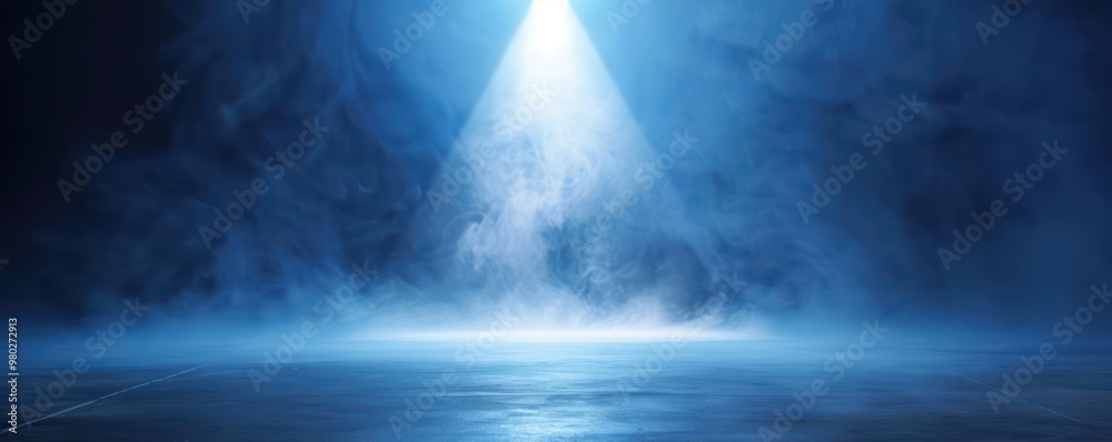 Fototapeta premium A mesmerizing scene featuring blue light beam cutting through fog, creating an ethereal atmosphere perfect for dramatic visuals.