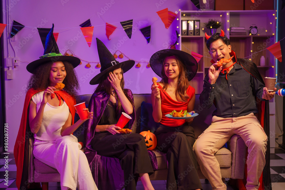 Obraz premium An African American woman and a white woman celebrate with coworkers, drinking, having fun, and smiling together at a lively Halloween night party filled with joy and laughter.