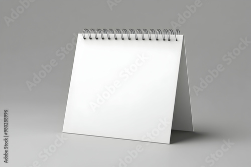 Blank white desktop calendar mockup on gray background.