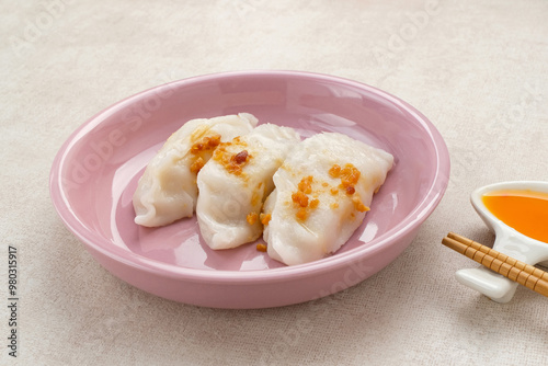 Choipan, made from rice flour filled with shredded jicama and sprinkled with fried garlic. Traditional steamed snack from Pontianak, Indonesia.
 photo