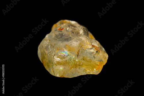 Natural rough Topaz gemstone on dark background