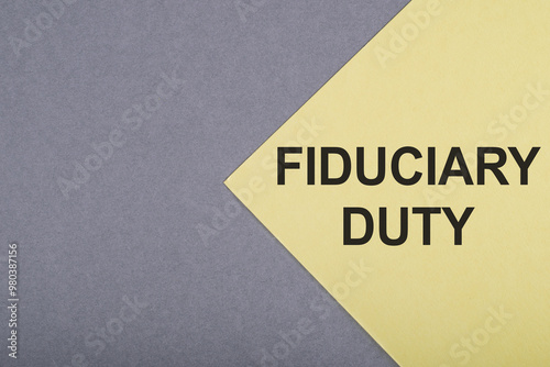 Fiduciary Duty Concept Illustrated on Yellow and Grey Paper photo