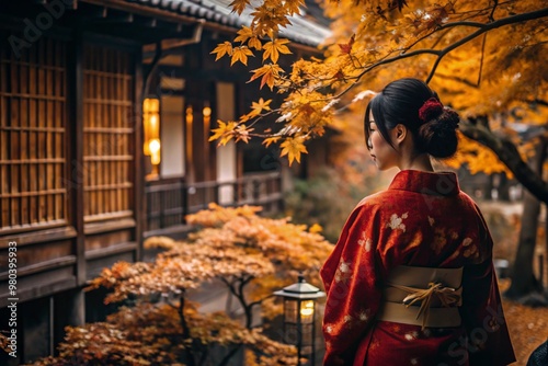 A Japanese girl in a traditional national costume - a kimono. On a fabulous background of lanterns and autumn trees. The portrait symbolizes the traditions and culture of the people of Japan.