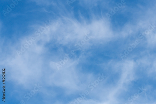 Canvas Print The afternoon sky with white soft high cirrus clouds
