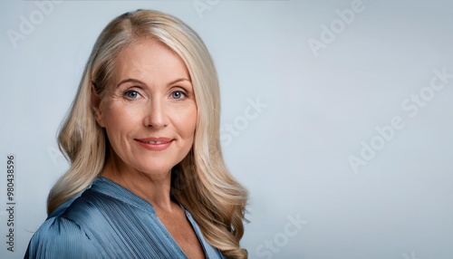 pretty middle-aged woman with straight blond hair, blue eyes