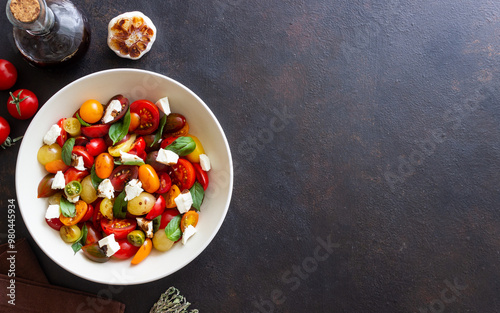 Salad with tomatoes, feta cheese, basil and balsamic vinegar. Healthy food. Vegetarian food.