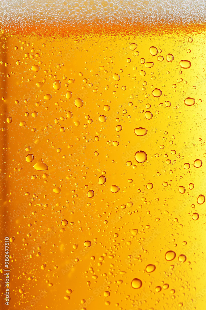 Close-up of yellow beer texture with white foam on top Close-up of yellow beer texture with white foam on top