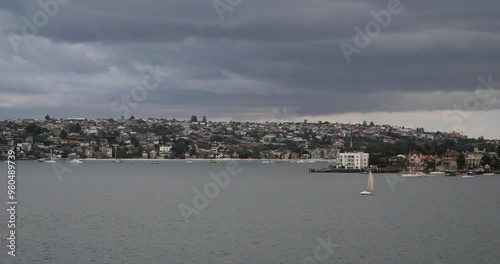 Sailing out from Port Jackson,Sydney, Australia, in a cloudy day. photo