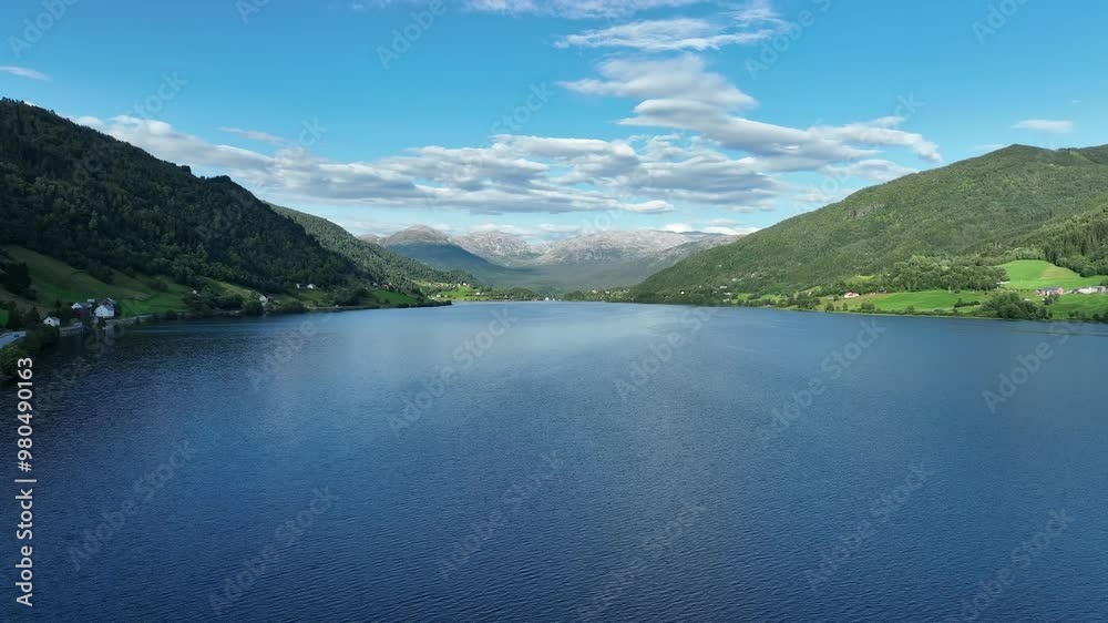 Oppheimsvatnet Lake in Voss with Brandset and Mjolfjell mountains in the background on a sunny summer day Oppheimsvatnet Lake in Voss with Brandset and Mjolfjell mountains in the background on a sunny summer day