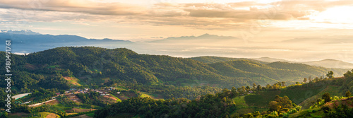 A beautiful mountain landscape with a small town in the valley