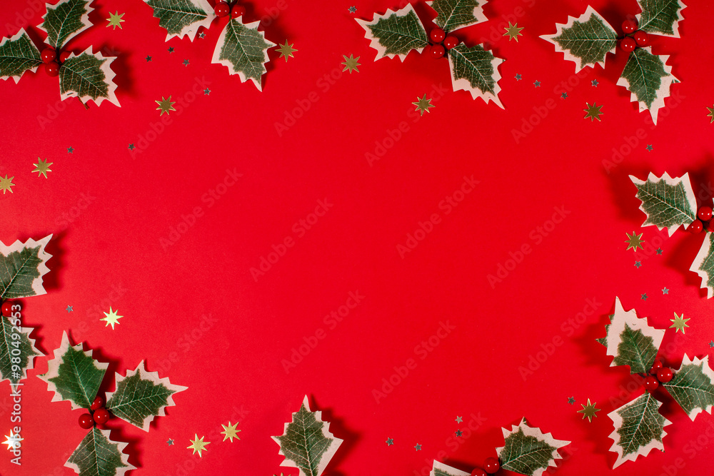 A red background with a row of green holly leaves and gold stars. Christmas greeting. A red background with a row of green holly leaves and gold stars. Christmas greeting.