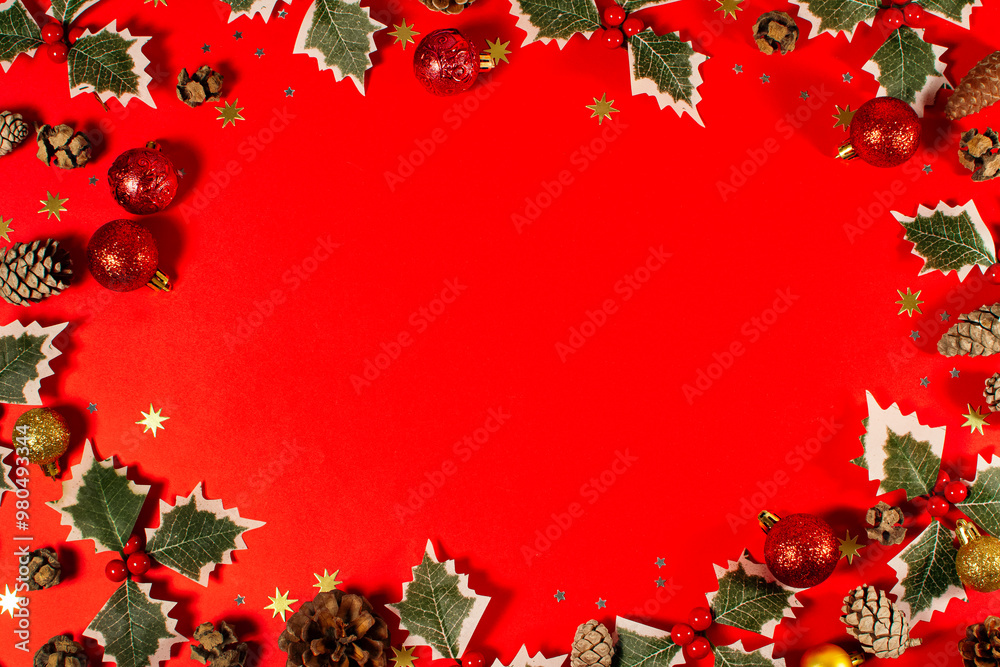 A red background with a Christmas tree decoration and balls. A red background with a Christmas tree decoration and balls.