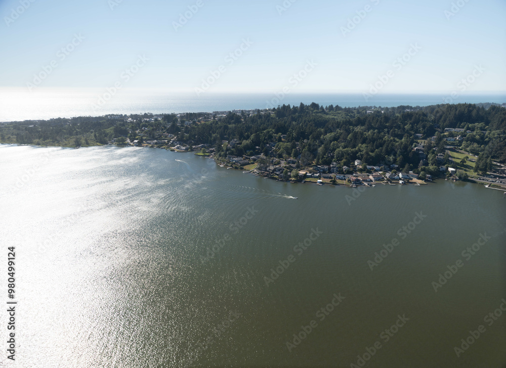 Fototapeta premium A beautiful view of a lake with a town in the background