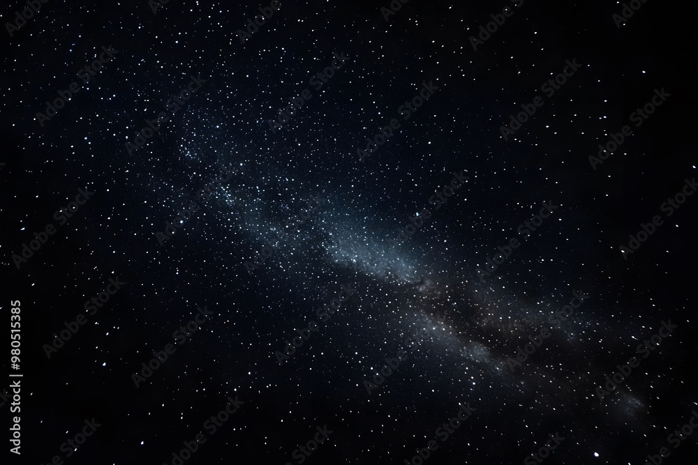 Fototapeta premium A dark night sky with stars and the Milky Way galaxy in view. 