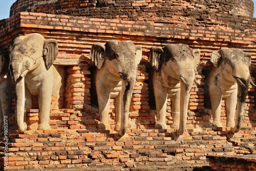 The elephant statues on the Wat Sorasak, Sarasak Pagoda, Temple at the Historical Park, the archaeological site, ancient ruins of Sukhothai, Thailand