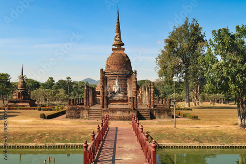 Canvas Print View onto the Wat Sa Si, Wat Sra Sri Temple with a red wooden bridge in the fore