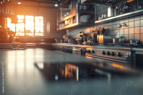 Modern kitchen with stainless steel appliances in warm evening light photo