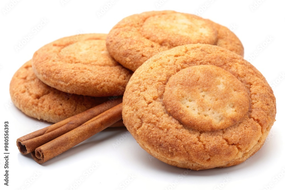 Stack of cinnamon cookies arranged on a wooden surface. Stack of cinnamon cookies arranged on a wooden surface.