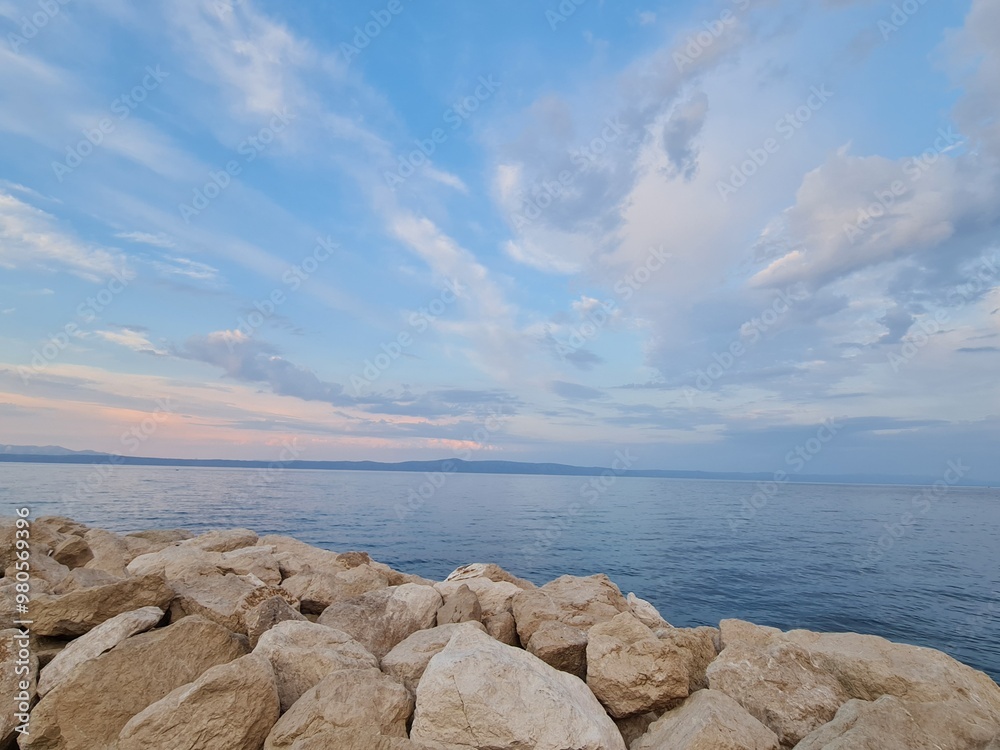 landscape with clouds. boat on the sea. rocks and sea. sunrise over the sea landscape with clouds. boat on the sea. rocks and sea. sunrise over the sea