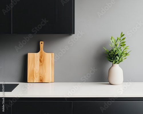 Compact modern kitchen with matte black flat-panel cabinets, light countertops, and a minimalist backsplash, minimalist design, modern cabinetry