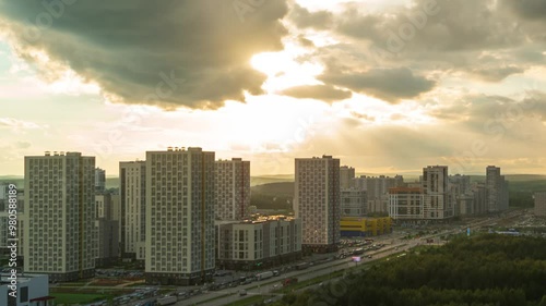 Ekaterinburg, Russia. The new residential area Akademichesky against the backdrop of a bright sunset. After the day comes the night. Timelapse photo