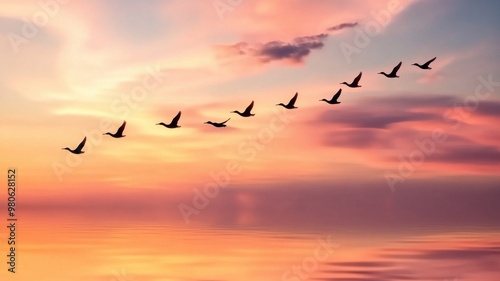 Wallpaper Mural A stunning sunset scene featuring a flock of birds gracefully flying in formation across the colorful sky. Torontodigital.ca