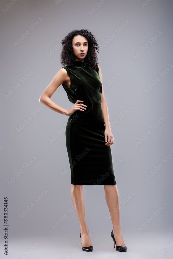 Confident fashion model posing with hand on hip Confident fashion model posing with hand on hip
