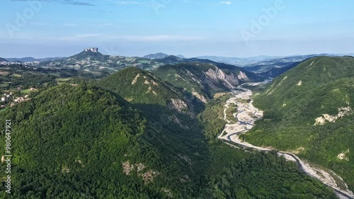 Timelapse aerial video of the Triassic gypsums valley of the Secchia River between the provinces of Reggio Emilia and Modena and the Bismantova stone in the Park of the Tuscan-Emilian Apennines photo