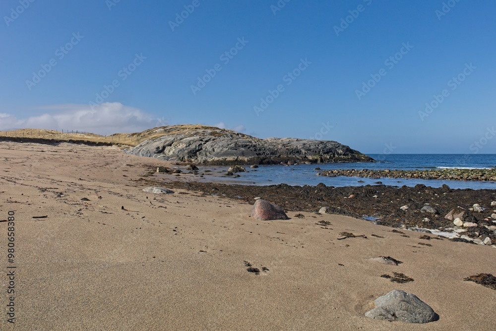 Beach landscape view near Russian border on a sunny spring day, Grense Jakobselv, Norway. Beach landscape view near Russian border on a sunny spring day, Grense Jakobselv, Norway.