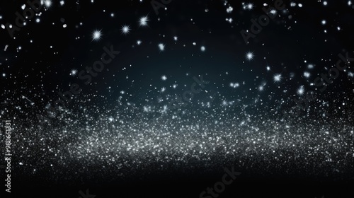 Silver sparkles on a black background