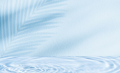 Water texture surface on blue wall background,Backdrop Summer nature light,palm leaves shadow on pool water ripple pattern for cosmetic product podium,Blue background for beautym,spa banner