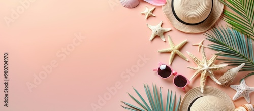 Top view of stylish beach items on a pastel pink backdrop with a panoramic banner offering room for text in a copy space image photo