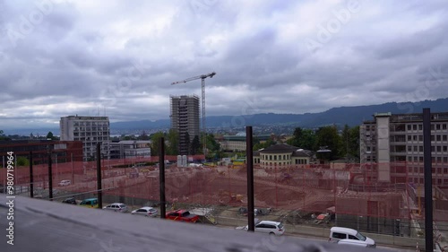 High angle view of foundation ditch at construction site of University Hospital with skyline in the background on a cloudy late summer day. Movie shot September 18th, 2024, Zurich, Switzerland. photo