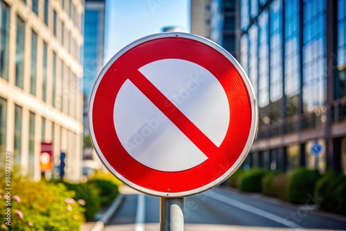 A bold red circle with a white background and a white diagonal line, indicating prohibition or restriction, stands photo