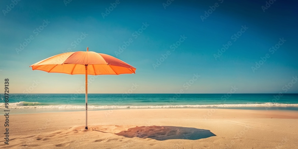 Soft pastel peach beach umbrella stands solo in the sand, its vibrant canvas a pop of color against a serene blue sky and calming ocean backdrop. Soft pastel peach beach umbrella stands solo in the sand, its vibrant canvas a pop of color against a serene blue sky and calming ocean backdrop.