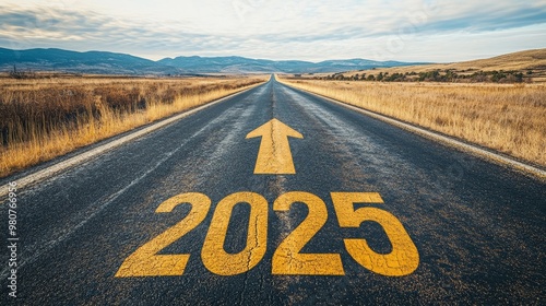 “2025"is written in yellow on the open asphalt road, with arrows pointing towards the future, symbolizing hope and progress, and a broad sky covered in clouds above.