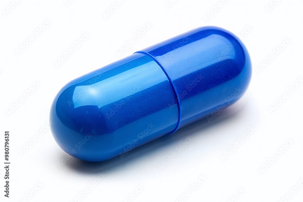 A single blue pill with a distinctive shape and scoring lies on a white background, conveying a sense A single blue pill with a distinctive shape and scoring lies on a white background, conveying a sense