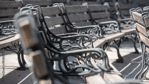 empty wooden classic park benches without people