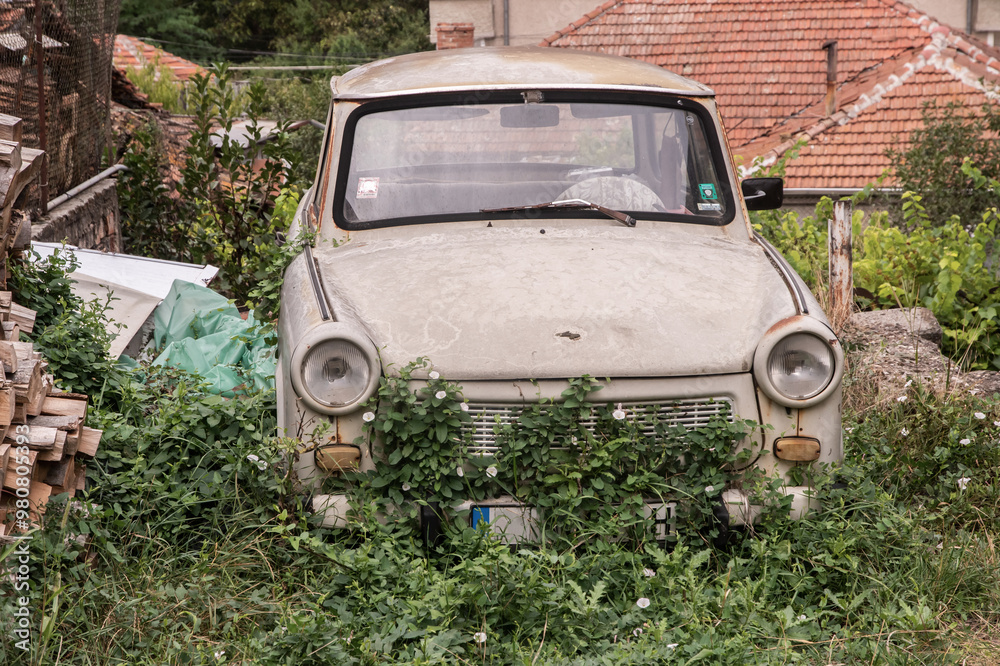 Abandoned old neglected Trabant car in eastern Europe village Abandoned old neglected Trabant car in eastern Europe village